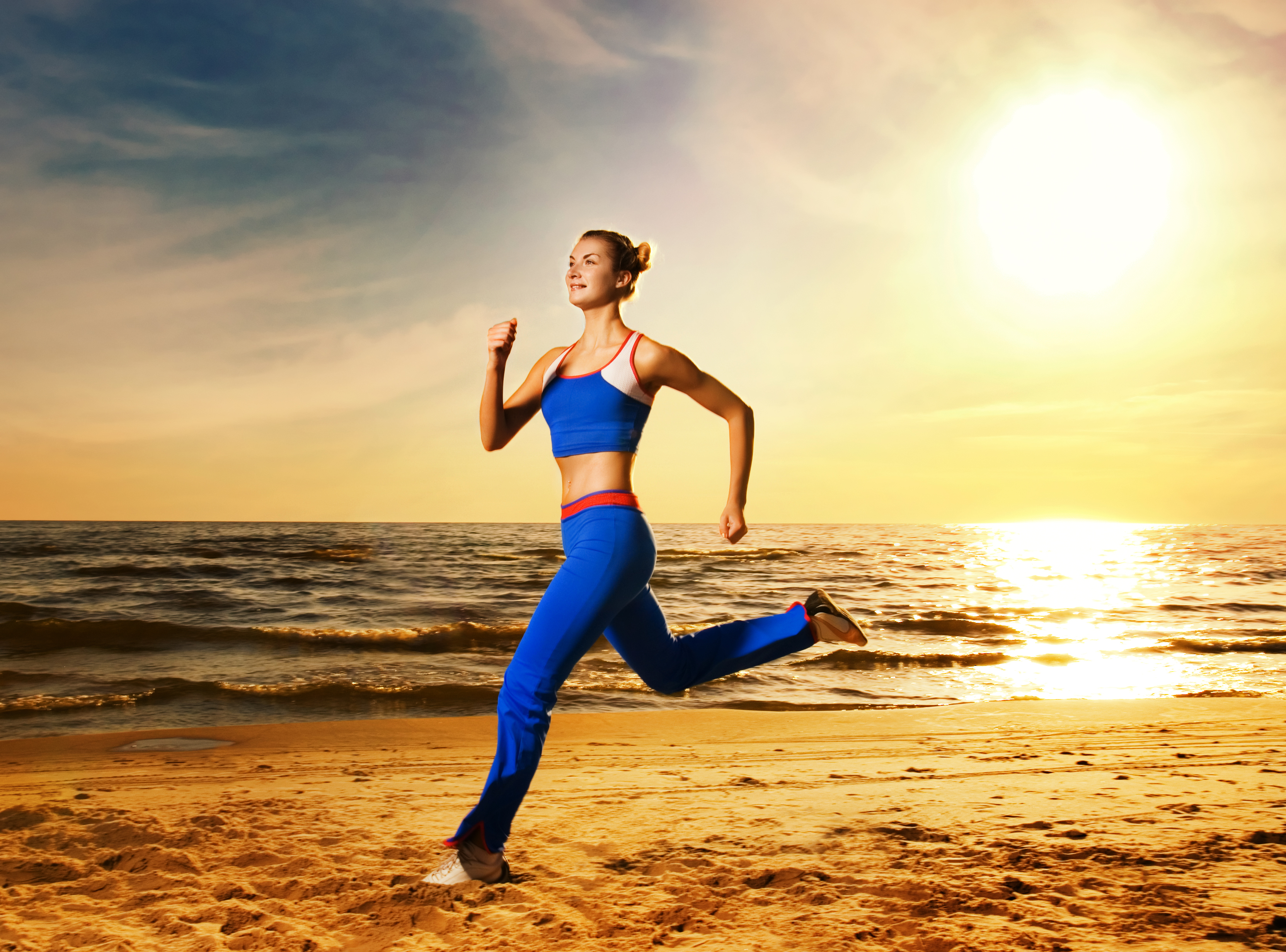 Beautiful Young Woman Running On A Beach At Sunset Beautiful Young